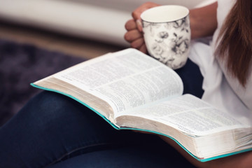 Close Up Of Young Lady Studying Her Bible