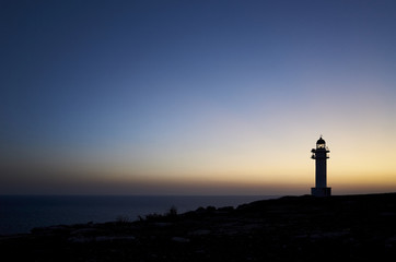 Barbaria Cape Lighthouse in spanish Formentera Island at the sunset