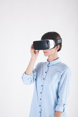 girl in virtual reality headset on white background looking to the right