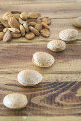 Fototapeta na wymiar Group of almonds with hammer