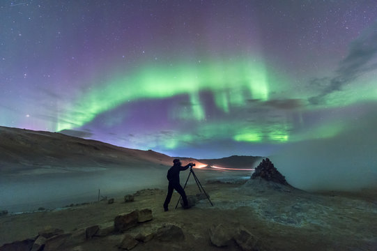 Photographer and northern lights in Iceland