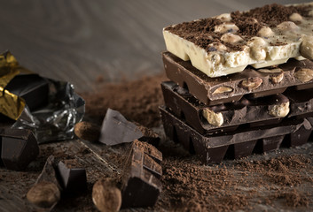 Chocolate / Chocolate bar on dark wooden background