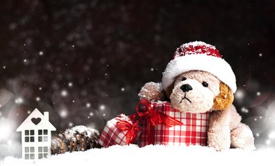 decorative Christmas toy-dog, gifts in the snow