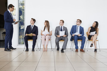 Obraz premium Recruiter and people waiting for job interviews, full length