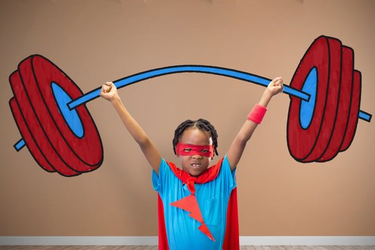 Composite image of boy in superhero disguise standing with hands