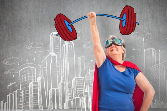 Composite image of senior woman disguise as superhero with hand