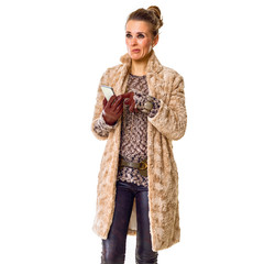 Fototapeta premium pensive stylish fashion-monger on white writing sms