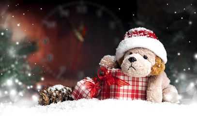Fototapeta na wymiar decorative Christmas toy-dog, gifts in the snow