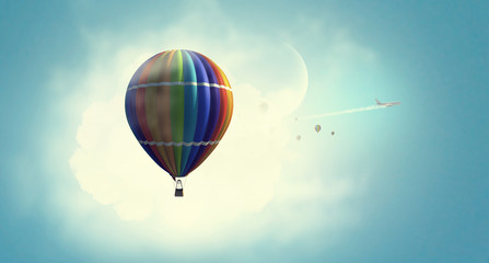 Fototapeta premium Aerostat floating in day sky. Mixed media