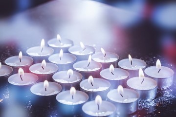 Obraz na płótnie Canvas Burning candles on table