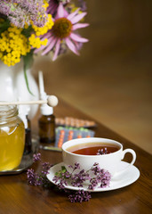 Still life from medicinal herbs, honey, herbal tea and medicines