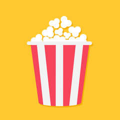 Popcorn. Big red yellow strip box. Cinema movie night icon in flat design style. Yellow background. Isolated.