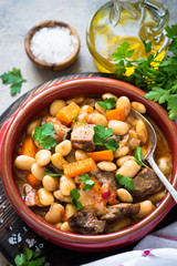 Beef stew with beans and vegetables.