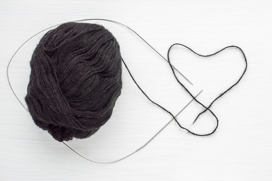 yarn thread in the form of heart. concept love to knitting