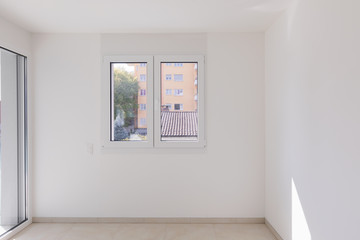 Empty room, frontal view with window