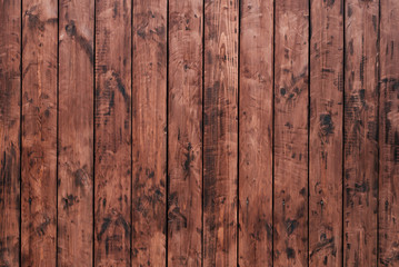 Brown, wooden board fence. Dark vintage wooden boards. Backgrounds and textures fence painted. Front view. Attract a beautiful vintage.