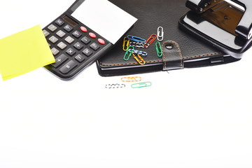 Calculator and stationery with copy space, close up