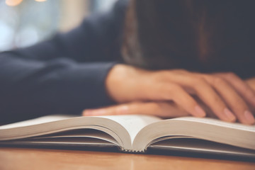 Tired Asian woman sleeping.