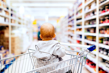 Little baby boy at the supermarket. © Halfpoint