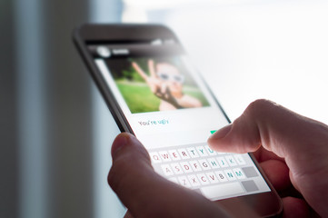 Cyber bullying, internet trolling and bad behavior online concept. Person writing mean comment to...
