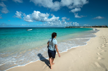 Fototapeta na wymiar Woman in a caribbean beach