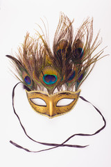 carnival venetian mask with peacock feathers isolated over white with clipping path