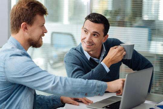Positive delighted people having coffee break