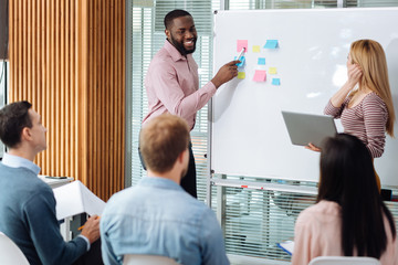 Attentive woman controlling group presentation