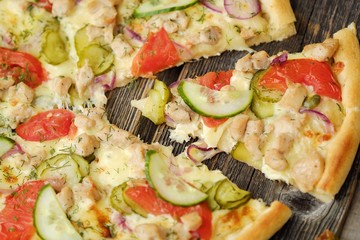 Delicious pizza with chicken cheese and vegetables