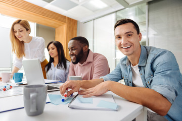 Obraz premium Smiling male person looking at camera