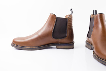 Male brown leather shoe on white background, isolated product, comfortable footwear.