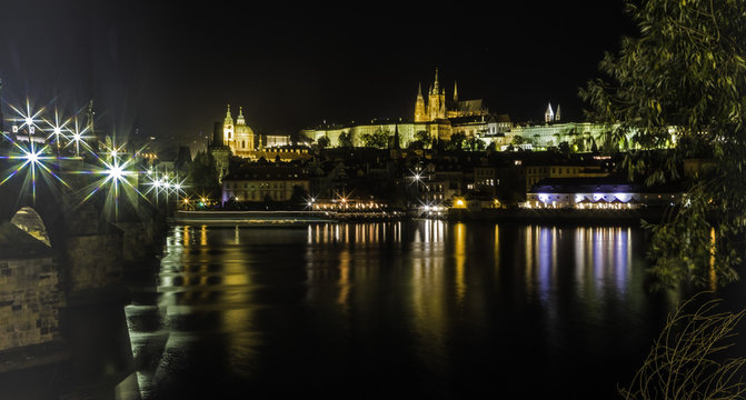 Prague by the Charles bridge at night