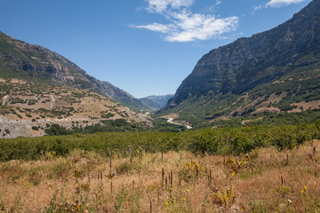 Horizontal shot of Provo Canyon with wide field and blue sky