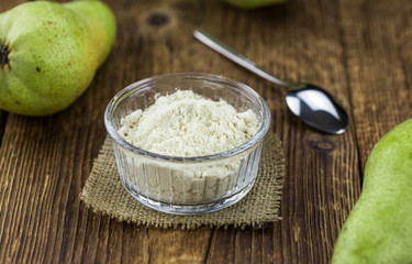 Some fresh Pear powder (selective focus; close-up shot)