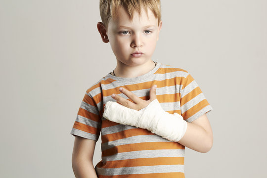 sad little boy.child with a broken arm