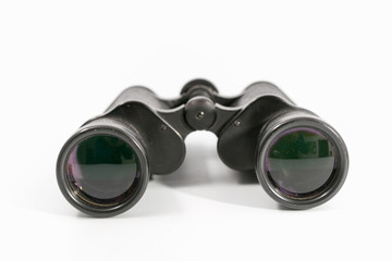 binoculars with large magnification on a monophonic background.