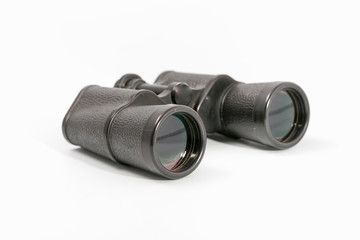 binoculars with large magnification on a monophonic background.