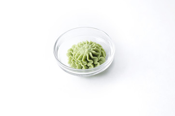 Wasabi sauce in a transparent saucepot