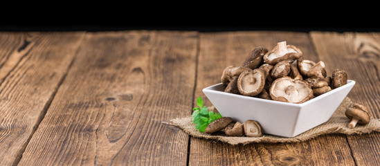 Portion of Raw Shiitake mushrooms, selective focus © HandmadePictures