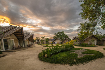 Small guest houses over a beautiful sunset. Philippines. The island of Palawan.