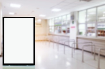 blank advertising billboard or showcase light box with copy space for your text message or media and content in waiting zone for pay money and receive medicine at cashier pharmacy counter at hospital
