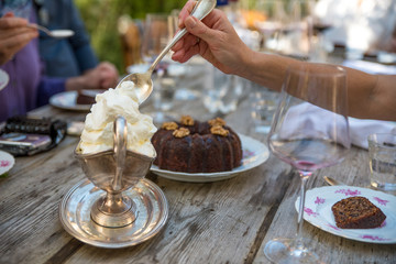Serving up whipped cream with cake