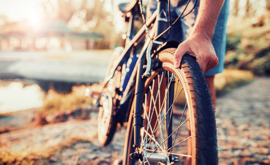 Naklejka premium Cyclist riding a bike in the park. Sport and recreation concept