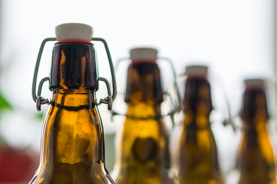 Close up of empty beer bottles. Shallow depth of focus. Concept Save the planet, recycle.|