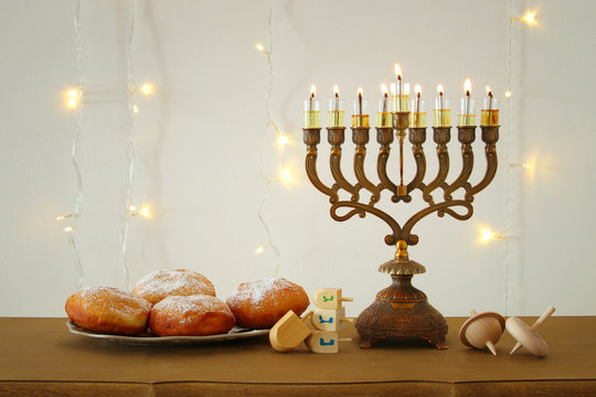 image of jewish holiday Hanukkah background with traditional spinnig top, menorah (traditional candelabra)