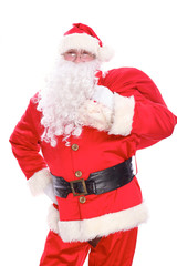 Kind Santa Claus carrying big bag, isolated on white background