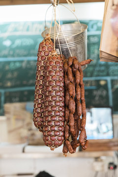 Dried meat and sausage hanging in a deli
