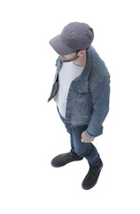 Naklejka premium view from above. guy in a baseball cap and denim jacket