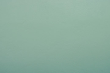 green concrete rough texture wall for background.