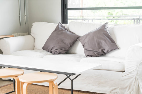 grey pillow on sofa